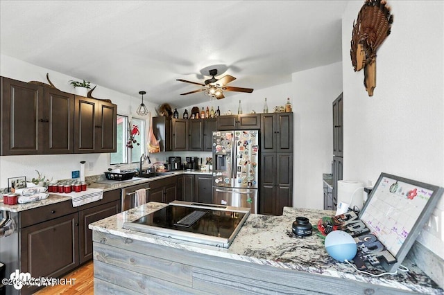 10845 Anvik Cir, Eagle River, AK 99577 - kitchen with stainless steel appliances, a ceiling fan, dark brown cabinetry, and a peninsula