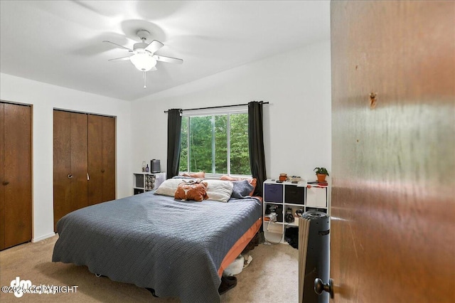 10845 Anvik Cir, Eagle River, AK 99577 - carpeted bedroom featuring two closets and a ceiling fan