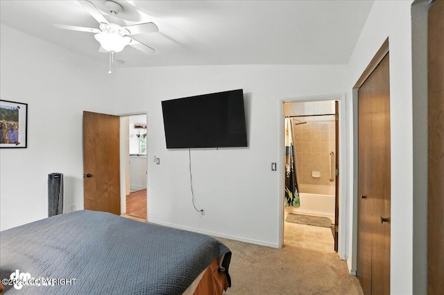 10845 Anvik Cir, Eagle River, AK 99577 - bedroom with light carpet, connected bathroom, and a ceiling fan