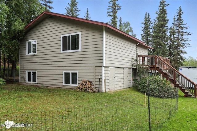 10845 Anvik Cir, Eagle River, AK 99577 - view of property exterior featuring stairway and a wooden deck