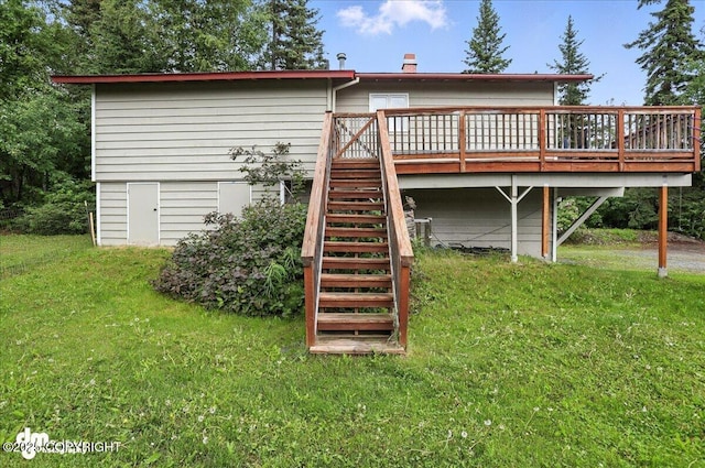 10845 Anvik Cir, Eagle River, AK 99577 - rear view of house featuring a deck, a lawn, and stairs