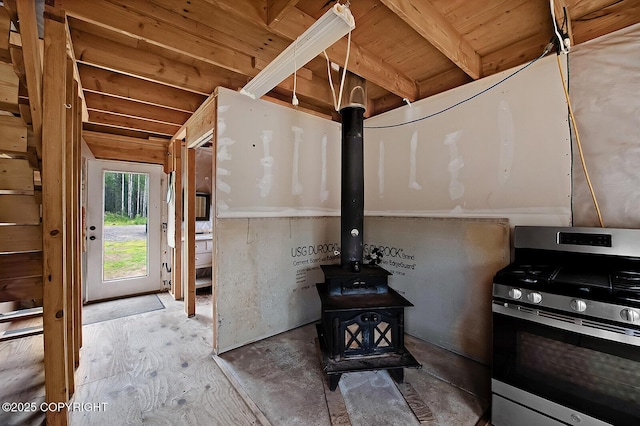 69222 S Parks Hwy, Willow, AK 99688 - detailed view of stainless steel gas range and a wood stove