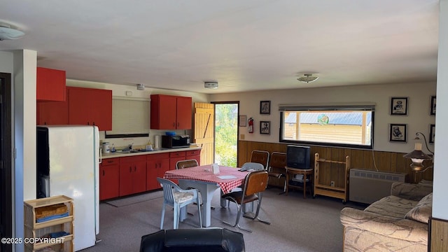 34704 Dolly Way, Sterling, AK 99672 - dining area with wainscoting, dark carpet, and wooden walls