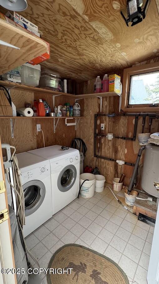 34655 Sockeye Ln, Sterling, AK 99672 - washroom with washer and clothes dryer and wood walls