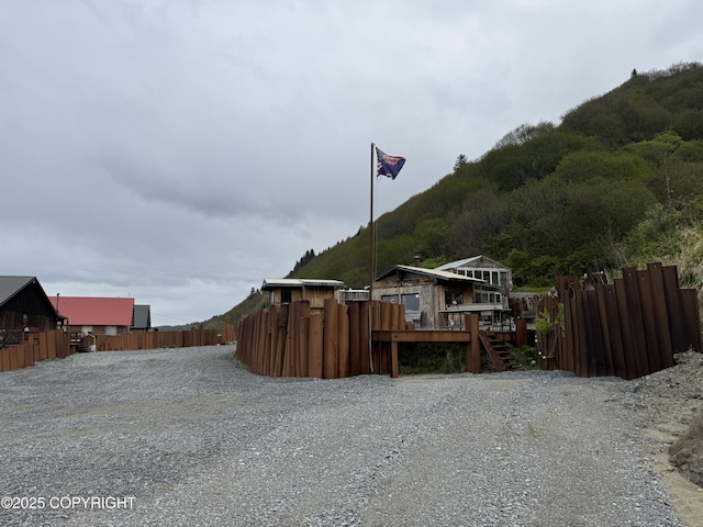25646 Hawks Beach Rem SW, Anchor Point, AK 99556 - view of side of home with a wooden deck and stairway