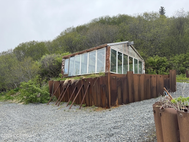 25646 Hawks Beach Rem SW, Anchor Point, AK 99556 - view of side of home featuring a wooded view