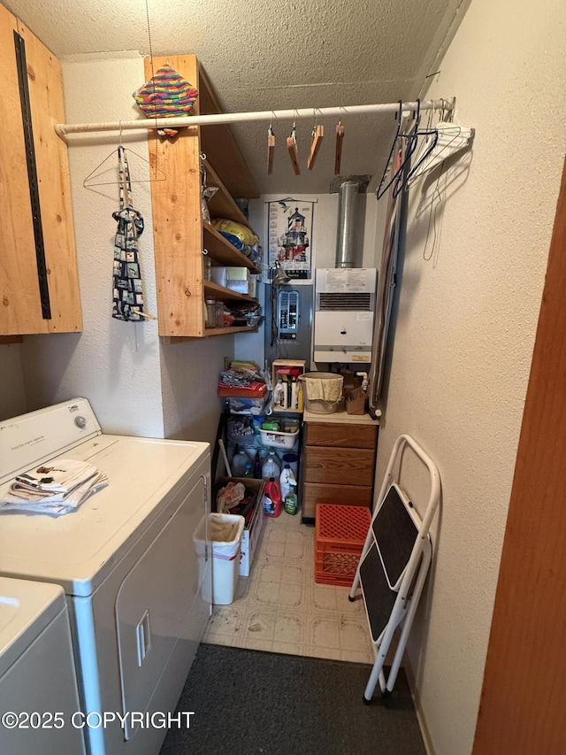 25646 Hawks Beach Rem SW, Anchor Point, AK 99556 - laundry room with washer and clothes dryer, cabinet space, tile patterned floors, and a textured ceiling