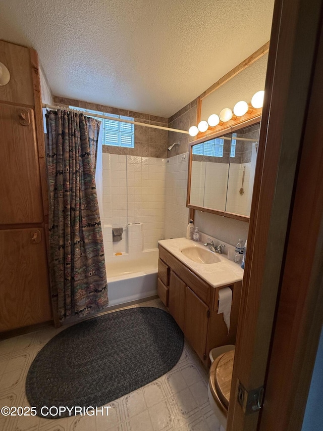 25646 Hawks Beach Rem SW, Anchor Point, AK 99556 - bathroom featuring tile patterned floors, shower / tub combo with curtain, vanity, and a textured ceiling