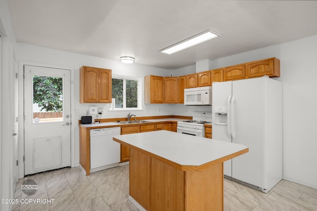 5622 E 4th Ave Unit 12, Anchorage, AK 99504 - kitchen with white appliances, light marble finish flooring, plenty of natural light, and light countertops