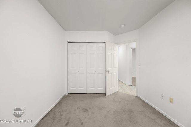 5622 E 4th Ave Unit 12, Anchorage, AK 99504 - unfurnished bedroom with carpet flooring and a closet
