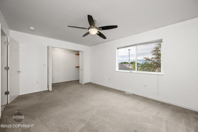 5622 E 4th Ave Unit 12, Anchorage, AK 99504 - unfurnished bedroom with carpet floors, ceiling fan, and a closet