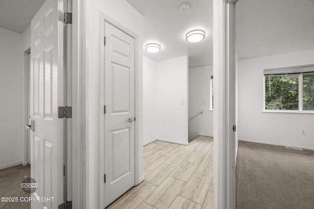 5622 E 4th Ave Unit 12, Anchorage, AK 99504 - hallway featuring baseboards