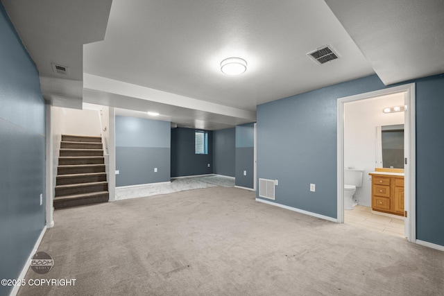 5622 E 4th Ave Unit 12, Anchorage, AK 99504 - finished basement with carpet and stairway
