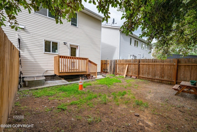 5622 E 4th Ave Unit 12, Anchorage, AK 99504 - back of property with a fenced backyard and a wooden deck