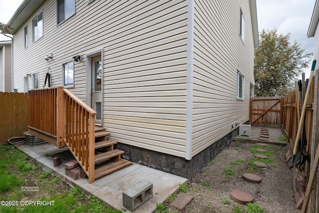 5622 E 4th Ave Unit 12, Anchorage, AK 99504 - view of side of home with an ac unit