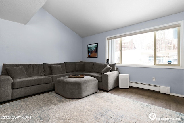 1441 E 17th Ave # 11, Anchorage, AK 99501 - living area featuring a baseboard radiator, vaulted ceiling, and wood finished floors
