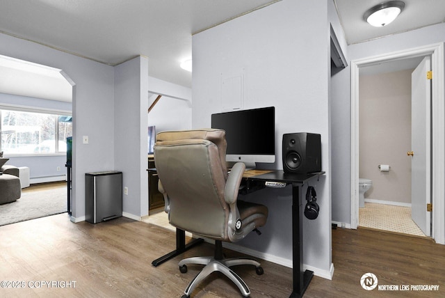 1441 E 17th Ave # 11, Anchorage, AK 99501 - office space featuring wood finished floors, arched walkways, and baseboard heating
