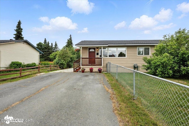 4335 E 6th Ave, Anchorage, AK 99508 - view of front of property featuring asphalt driveway