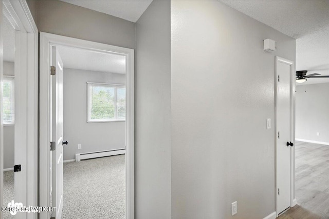 4335 E 6th Ave, Anchorage, AK 99508 - corridor with baseboard heating and baseboards
