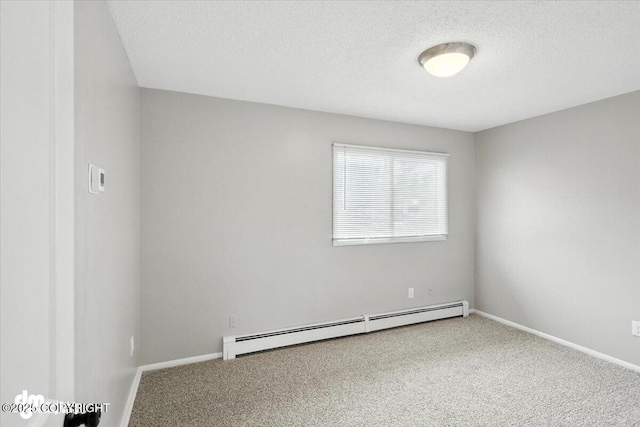 4335 E 6th Ave, Anchorage, AK 99508 - carpeted spare room with baseboard heating and a textured ceiling