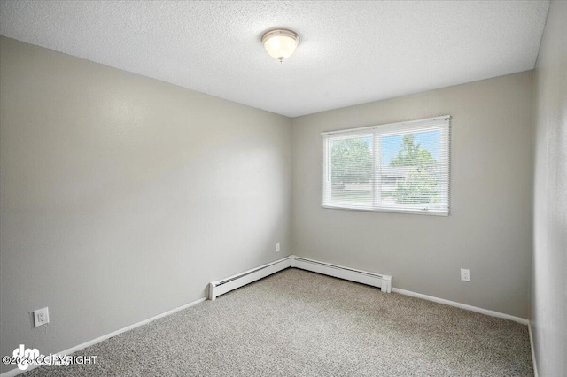 4335 E 6th Ave, Anchorage, AK 99508 - carpeted spare room featuring a textured ceiling and a baseboard heating unit