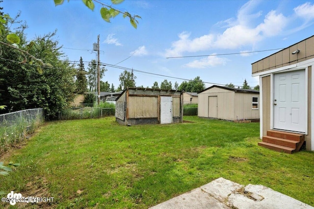 4335 E 6th Ave, Anchorage, AK 99508 - fenced backyard featuring entry steps and a shed