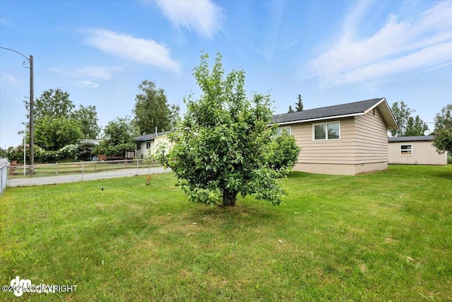 4335 E 6th Ave, Anchorage, AK 99508 - view of yard with concrete driveway