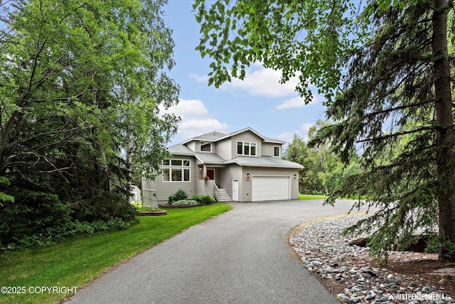 15250 Evergreen Ridge St, Anchorage, AK 99516 - view of front of home featuring a garage, driveway, and a front yard