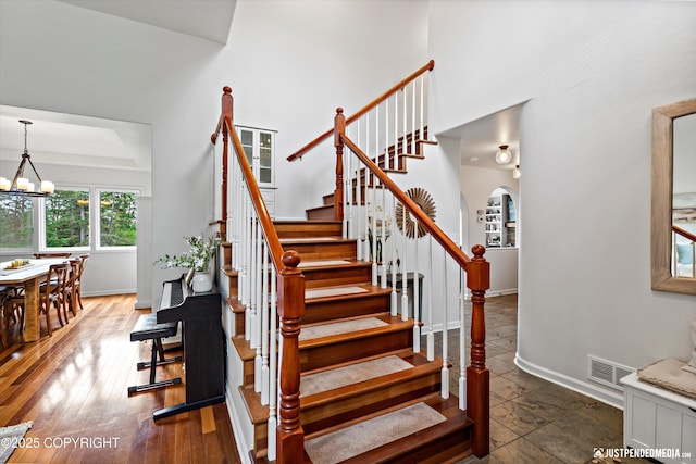 15250 Evergreen Ridge St, Anchorage, AK 99516 - stairway featuring baseboards and arched walkways