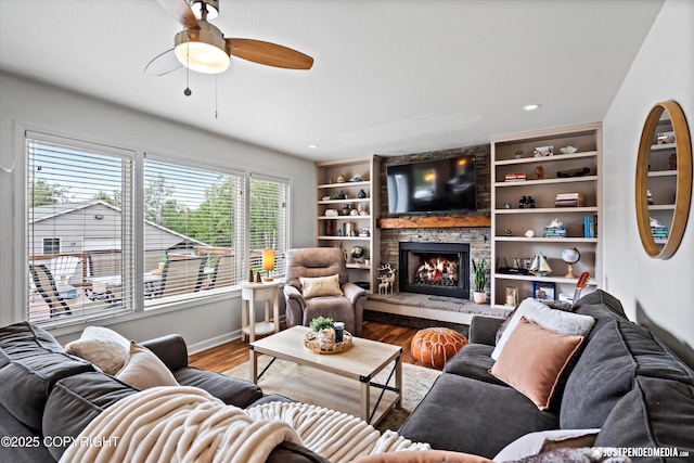 15250 Evergreen Ridge St, Anchorage, AK 99516 - living room with a ceiling fan, a stone fireplace, wood finished floors, recessed lighting, and built in features