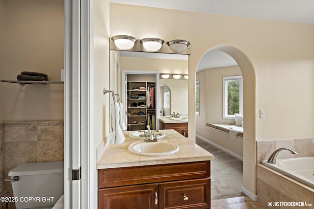 15250 Evergreen Ridge St, Anchorage, AK 99516 - full bathroom featuring vanity, a bath, and a spacious closet