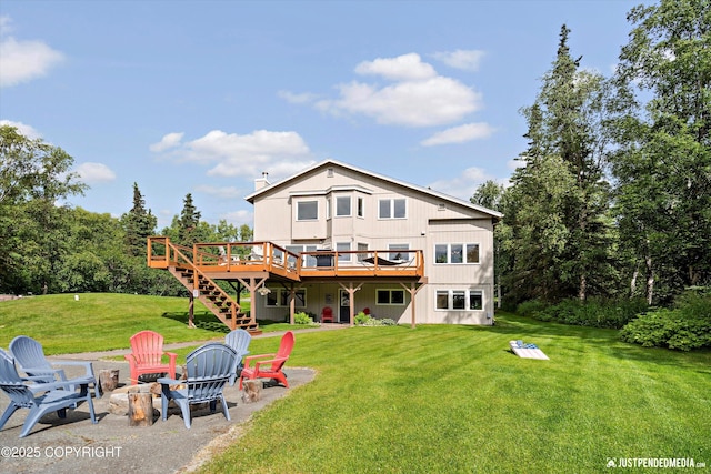 15250 Evergreen Ridge St, Anchorage, AK 99516 - rear view of house featuring a fire pit, a wooden deck, a yard, and stairs
