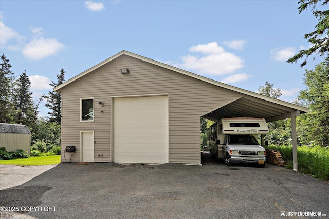 15250 Evergreen Ridge St, Anchorage, AK 99516 - garage with a garage and asphalt driveway
