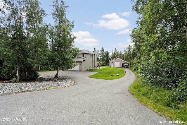 15250 Evergreen Ridge St, Anchorage, AK 99516 - view of front of house with driveway and a chimney