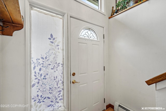 3217 Purdue St, Anchorage, AK 99508 - entrance foyer featuring a baseboard heating unit