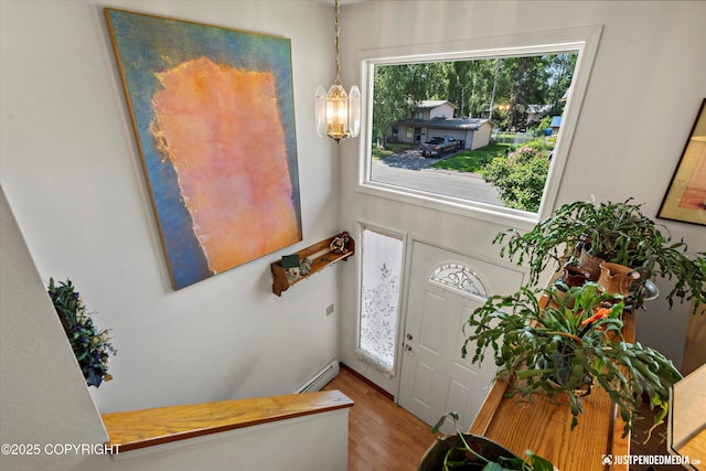 3217 Purdue St, Anchorage, AK 99508 - entrance foyer featuring wood finished floors and baseboard heating