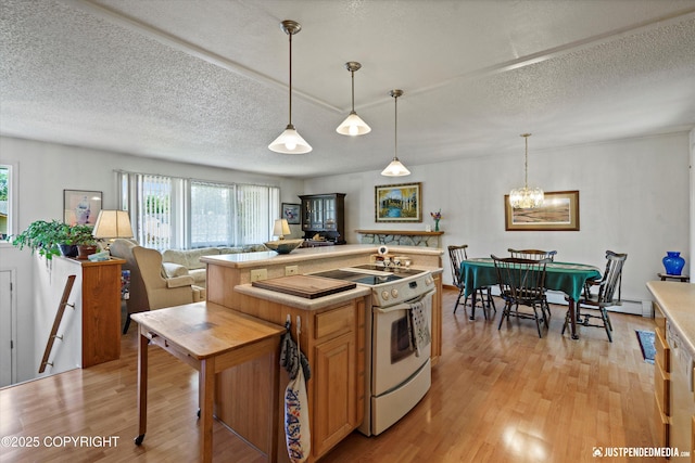 3217 Purdue St, Anchorage, AK 99508 - kitchen featuring white electric range oven, light wood-style floors, a textured ceiling, light countertops, and pendant lighting