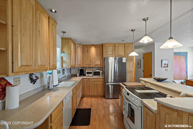 3217 Purdue St, Anchorage, AK 99508 - kitchen with white appliances, light wood-type flooring, hanging light fixtures, light stone countertops, and recessed lighting