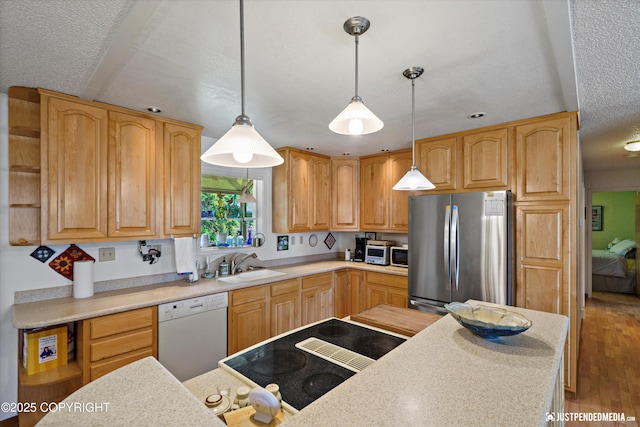 3217 Purdue St, Anchorage, AK 99508 - kitchen featuring freestanding refrigerator, dishwasher, light countertops, hanging light fixtures, and open shelves
