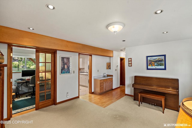 3217 Purdue St, Anchorage, AK 99508 - living area featuring a desk, light colored carpet, recessed lighting, and french doors