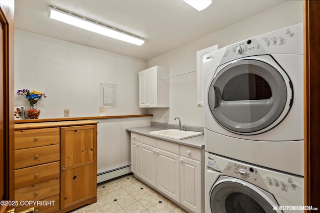 3217 Purdue St, Anchorage, AK 99508 - laundry area featuring estacked washer and dryer, a baseboard heating unit, cabinet space, electric panel, and light tile patterned flooring