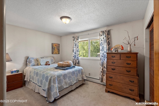 3217 Purdue St, Anchorage, AK 99508 - bedroom featuring a baseboard heating unit, light carpet, a textured ceiling, and a closet