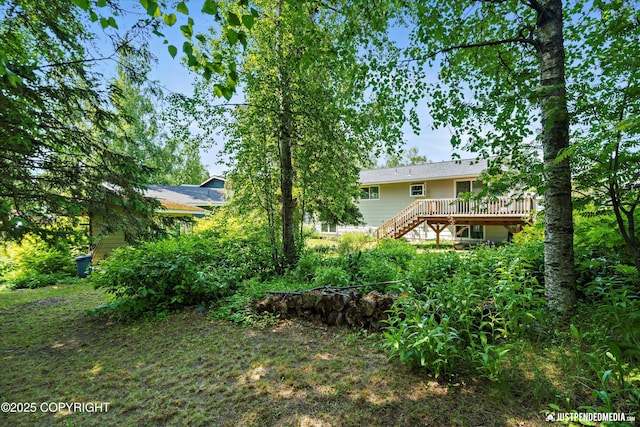 3217 Purdue St, Anchorage, AK 99508 - view of yard with a deck and stairs