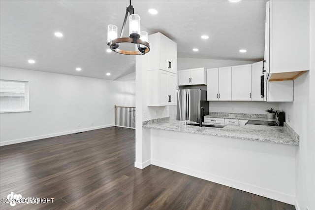 1928 Commodore Dr, Anchorage, AK 99507 - kitchen with freestanding refrigerator, a chandelier, white cabinetry, a peninsula, and recessed lighting