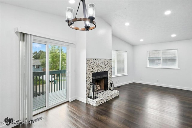 1928 Commodore Dr, Anchorage, AK 99507 - unfurnished living room with a chandelier, lofted ceiling, a fireplace, dark wood-style flooring, and recessed lighting