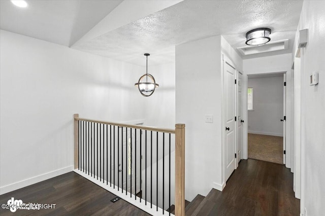 1928 Commodore Dr, Anchorage, AK 99507 - hall featuring an upstairs landing, wood finished floors, and a textured ceiling