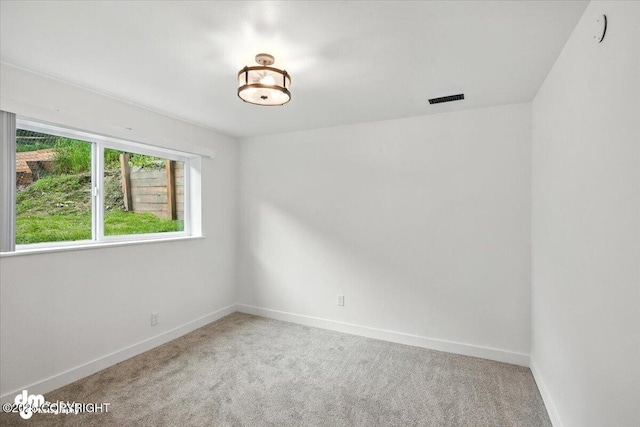 1928 Commodore Dr, Anchorage, AK 99507 - carpeted empty room with baseboards