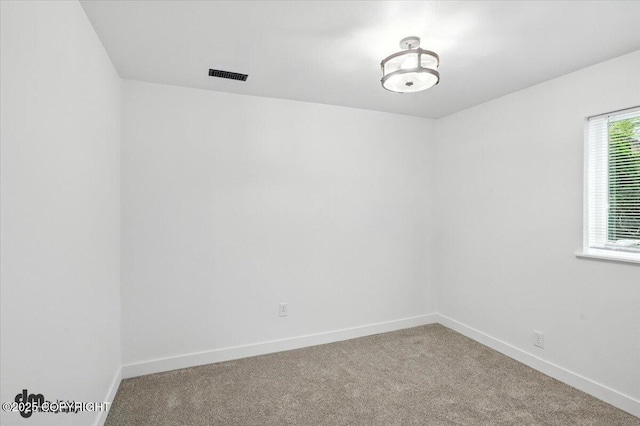 1928 Commodore Dr, Anchorage, AK 99507 - carpeted spare room with baseboards