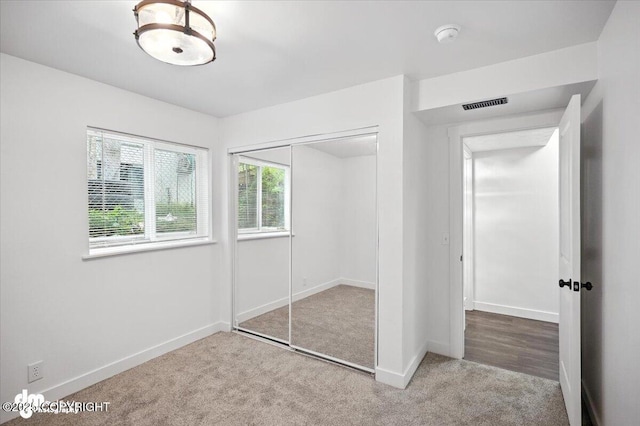 1928 Commodore Dr, Anchorage, AK 99507 - unfurnished bedroom featuring carpet flooring and a closet