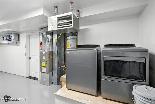 1928 Commodore Dr, Anchorage, AK 99507 - washroom featuring separate washer and dryer and a heating unit